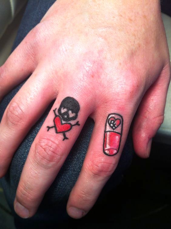 Little finger tattoos, skull and little pill