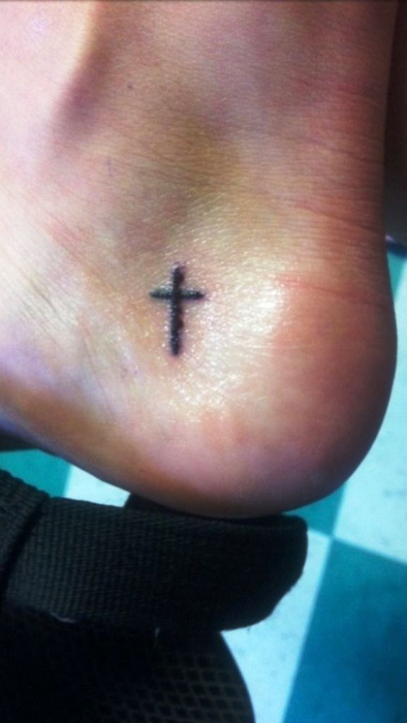 Small cross tattoo