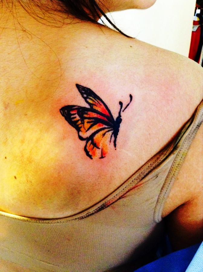 Small-red-watercolor-butterfly-tattoo