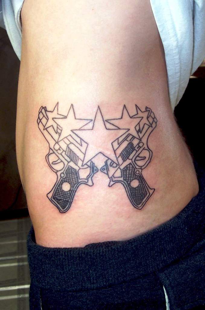 guns-n-stars-tattoo-on-waist