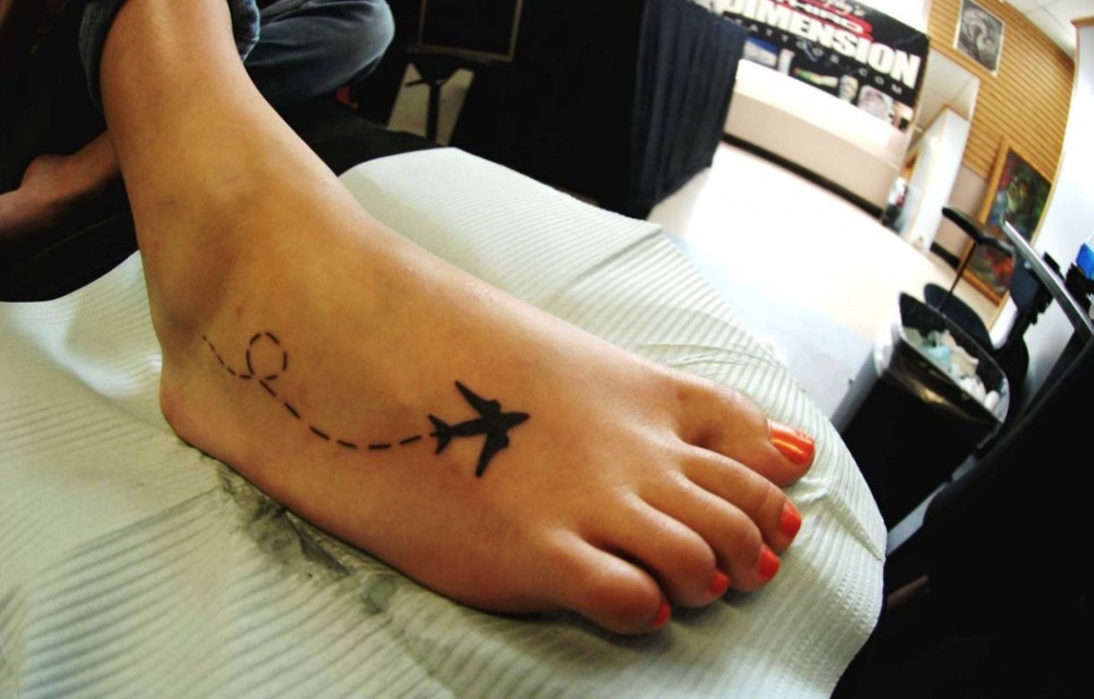 small-airplane-tattoo-on-right-foot-