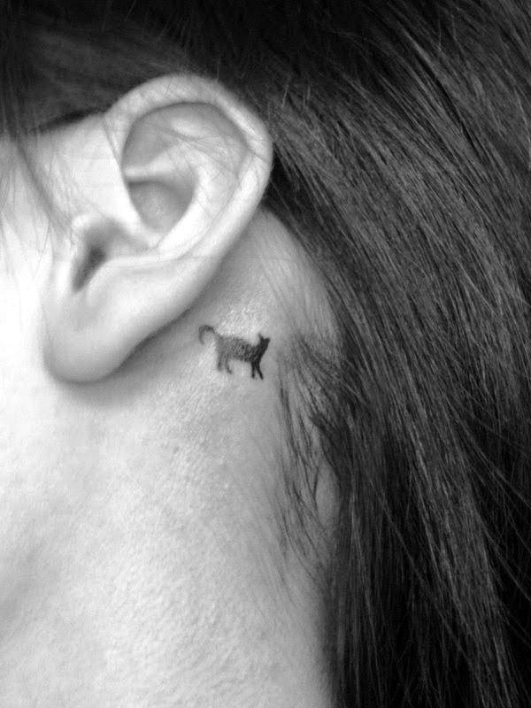 small cat tattoo behind ear