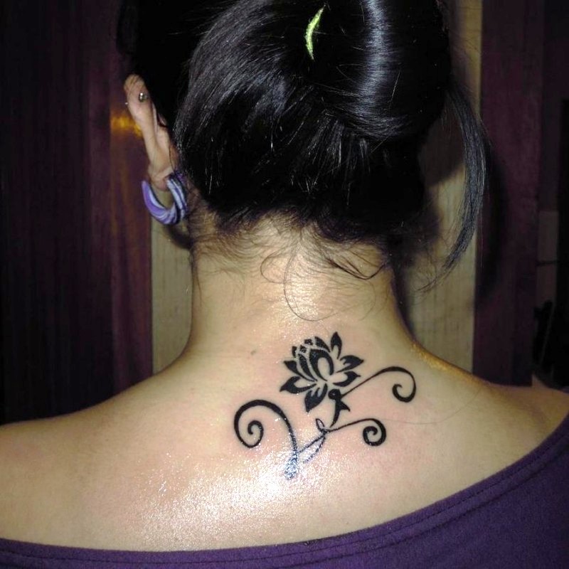 Awesome_small_black-ink_lotus_flower_with_curles_tattoo