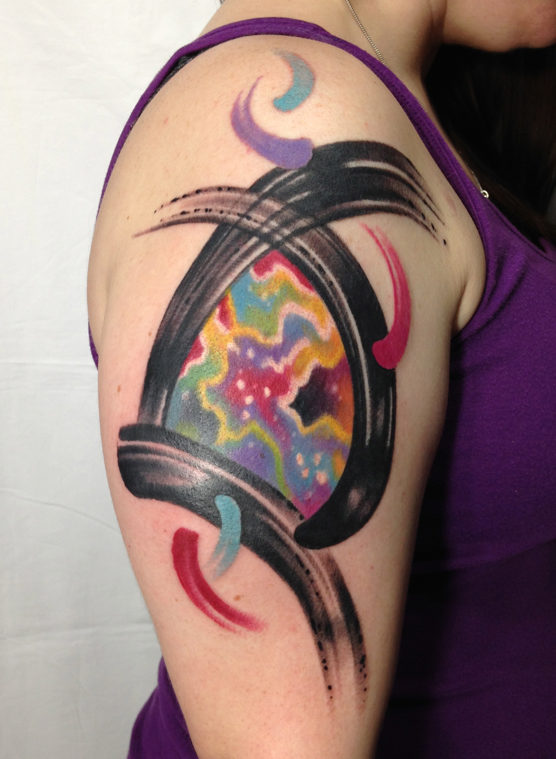 Colorful abstract watercolor tattoo