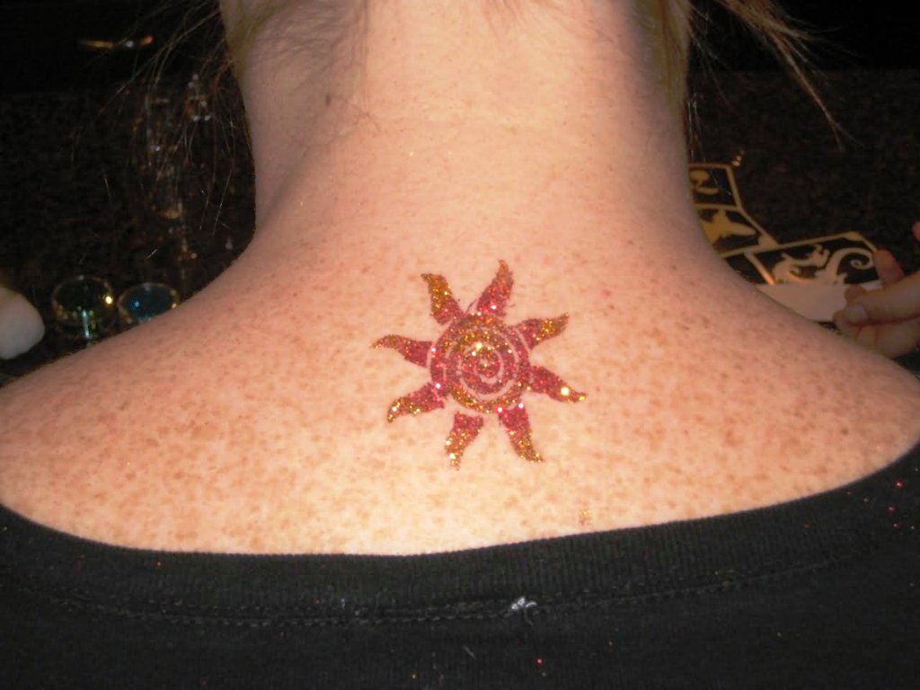 Small-Glitter-Sun-Tattoo-On-Upper-Back