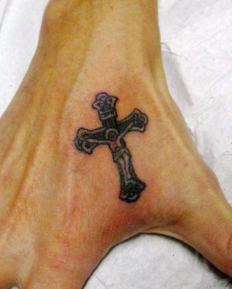 grey-ink-religious-cross-tattoo-on-right-hand