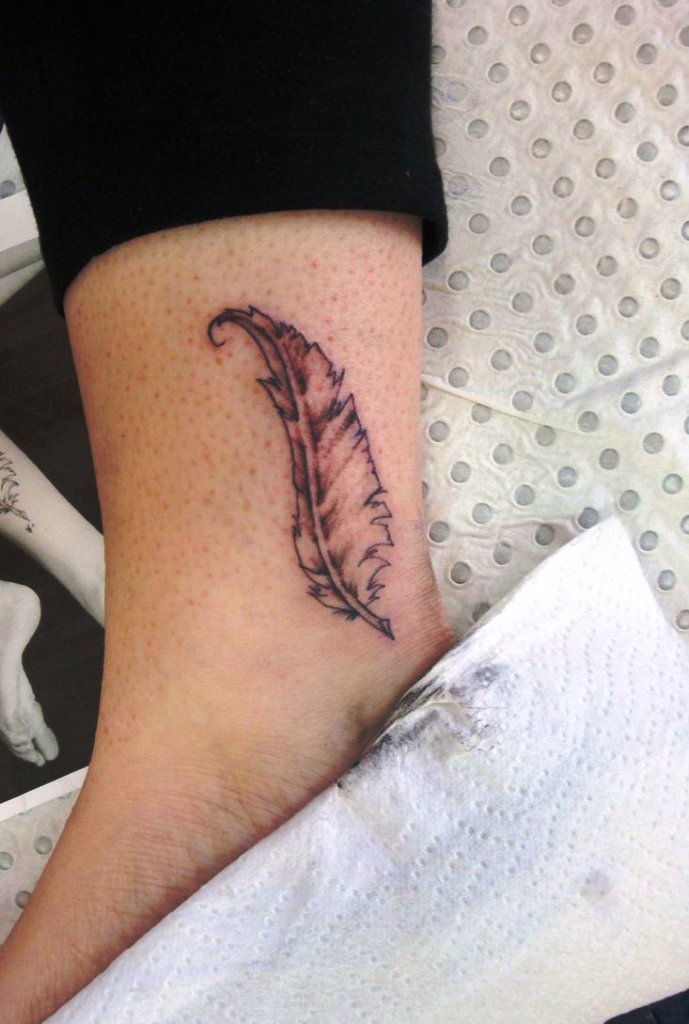 small-grey-ink-feather-tattoo