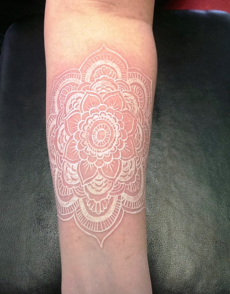 white-ink-mandala-tattoo-on-sleeve