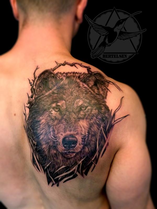 black-and-grey-realistic-wolf-tattoo