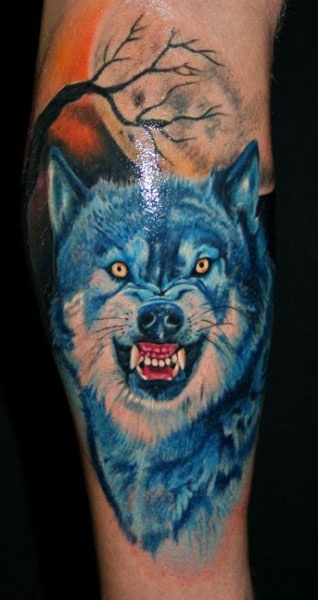 blue-ink-wolf-tattoo-on-arm