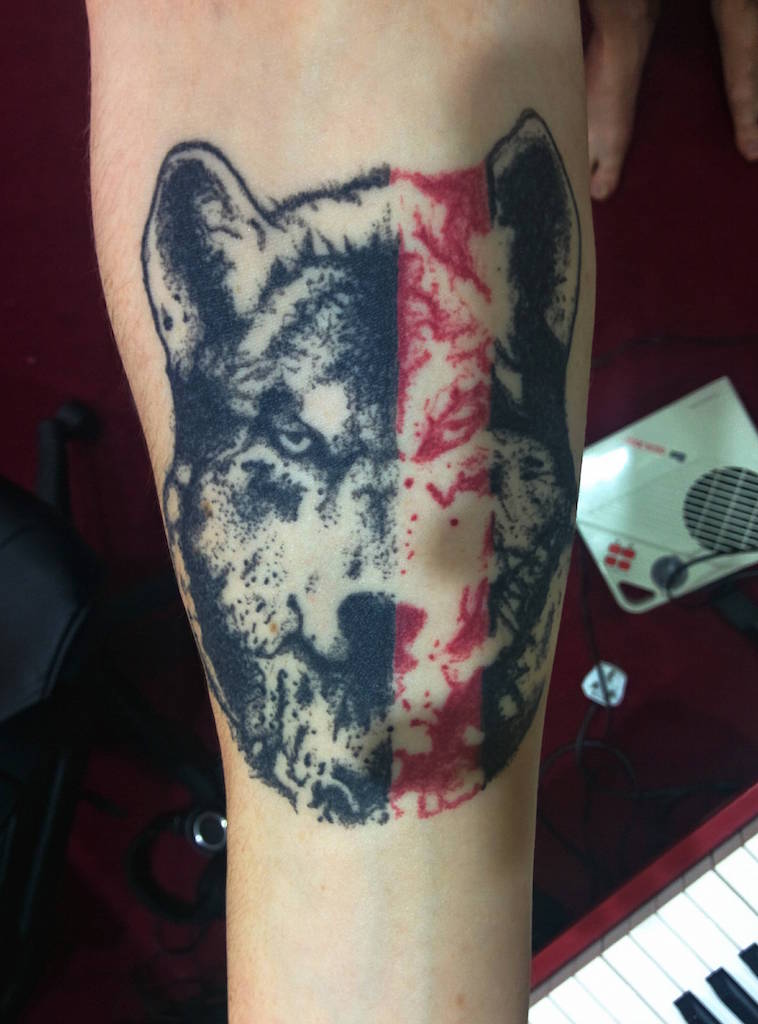 geometric-wolf-tattoo-forearm