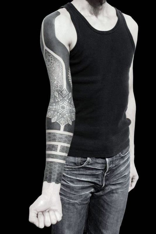heavy-black-ink-sleeve-tattoos