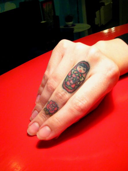 russian-doll-tattoo-finger