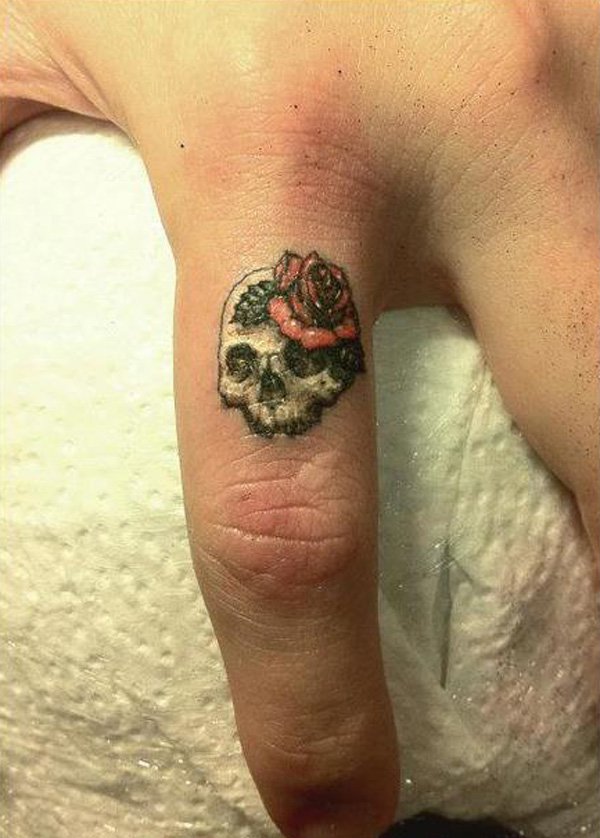 small-skull-finger-tattoo