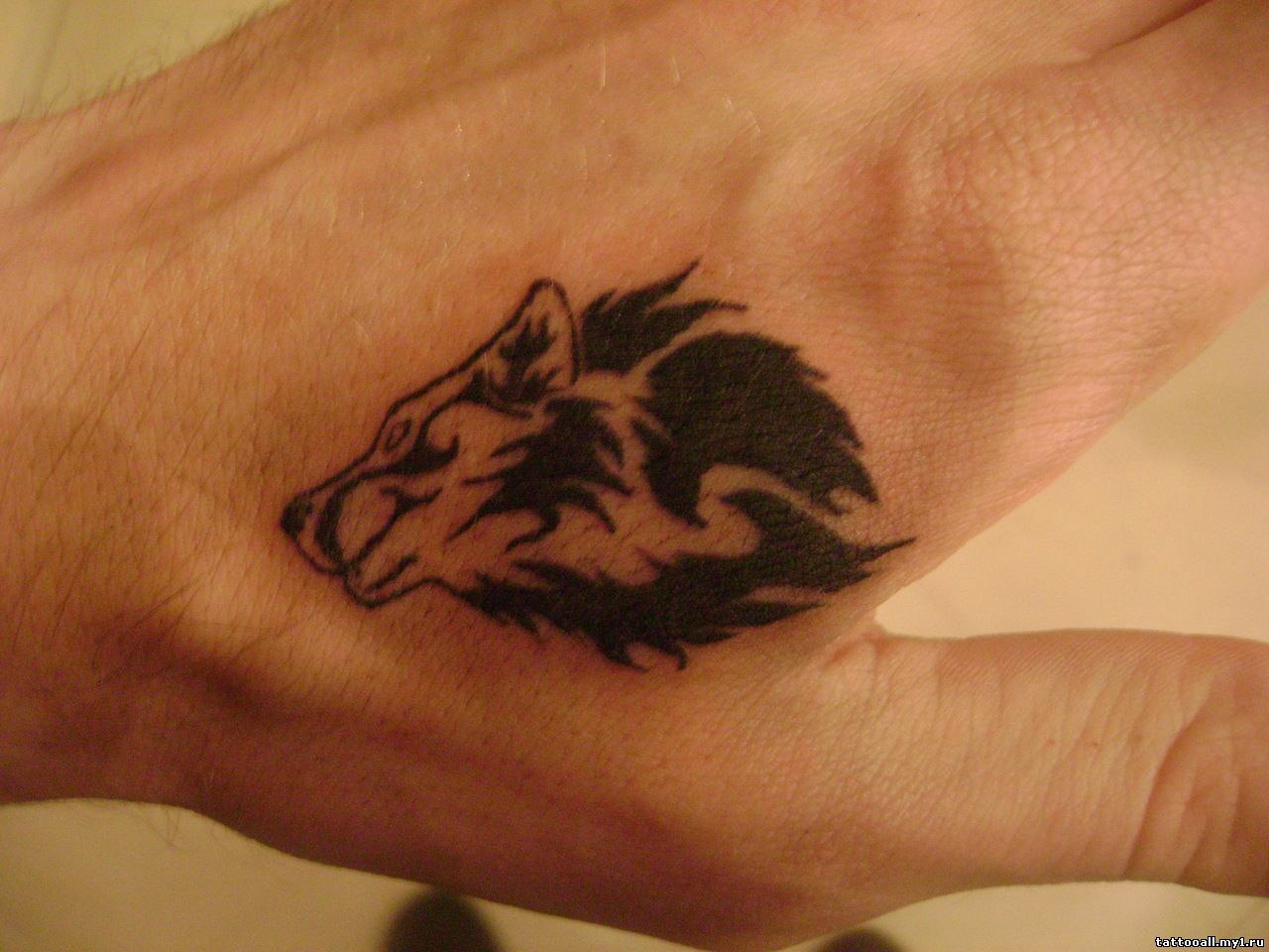 small-wolf-tattoo-on-hand