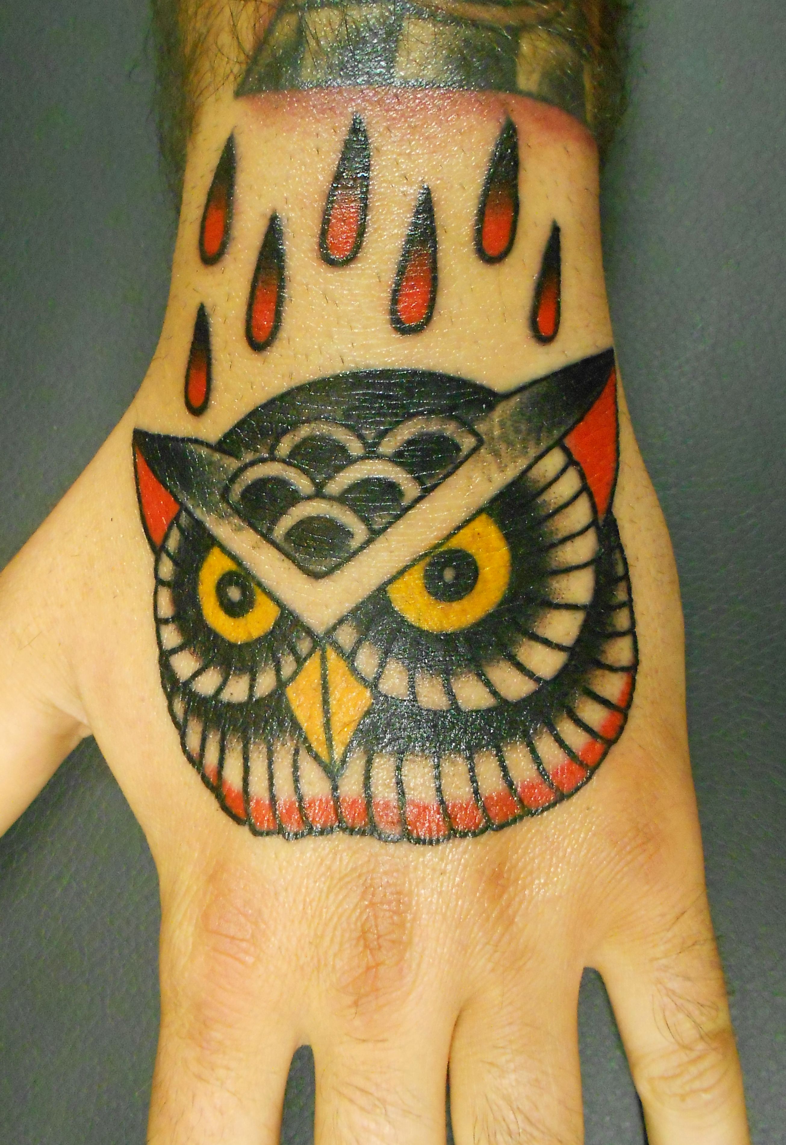 traditional-owl-tattoo-in-hands