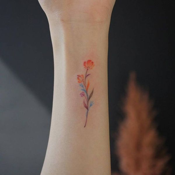 Small watercolor flower tattoo