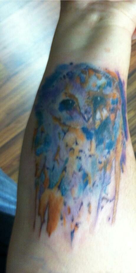 Watercolor Owl Tattoo in hand